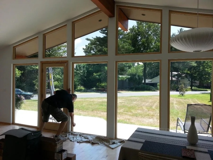 Professional Window Tinting expert installs storm protection window film to Mid Atlantic home.