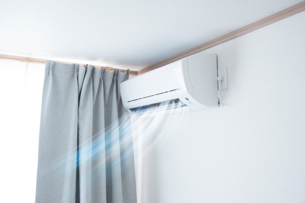 An air conditioning unit, blowing cool air into a room. 